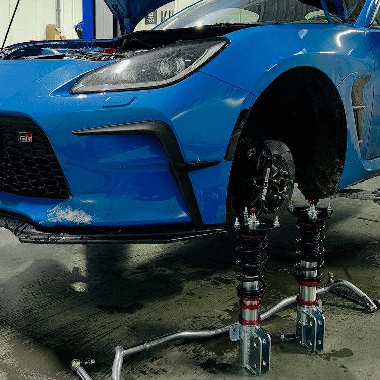 TL-PRO remote reservoirs in a Toyota GR Yaris engine bay